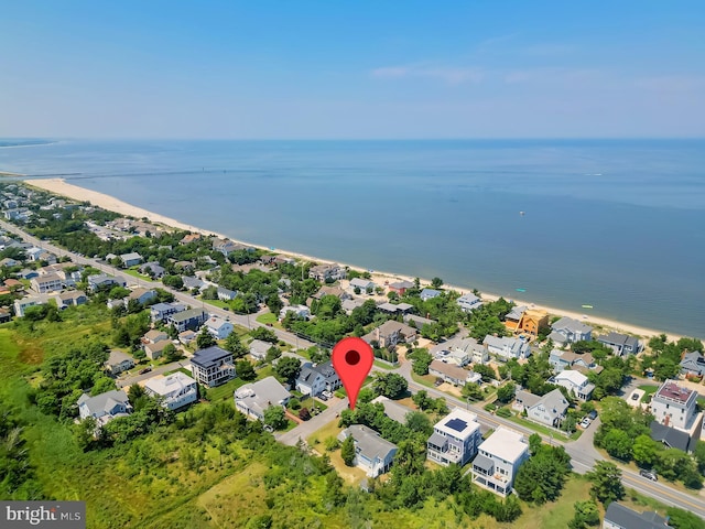 bird's eye view with a water view and a view of the beach