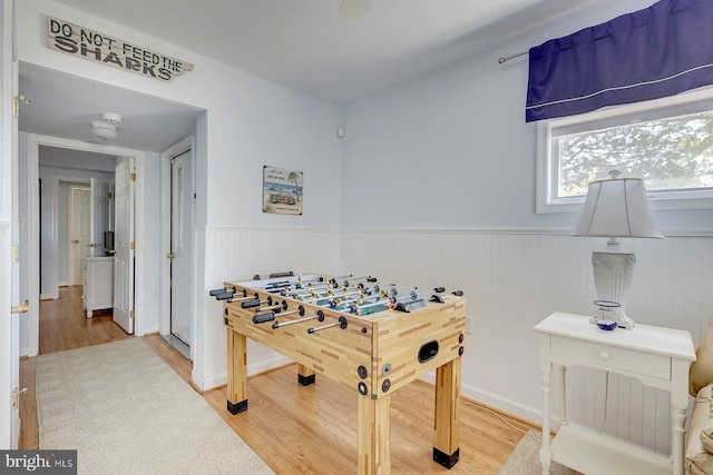 recreation room featuring hardwood / wood-style flooring