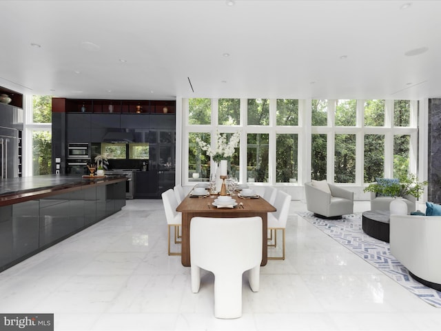 dining area featuring expansive windows