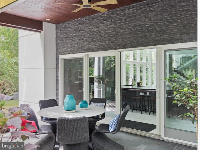 view of patio featuring ceiling fan