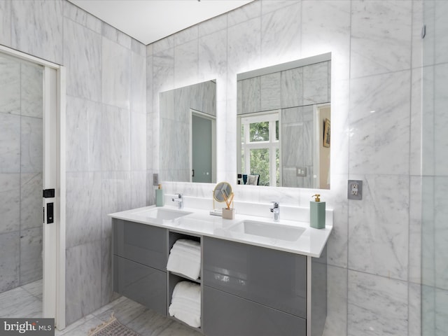 bathroom featuring tile walls and vanity