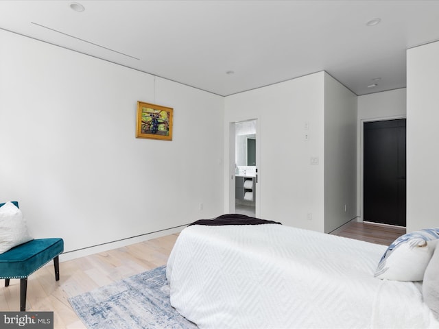 bedroom featuring hardwood / wood-style floors