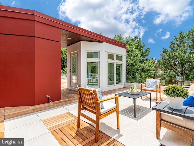 wooden deck featuring an outdoor hangout area