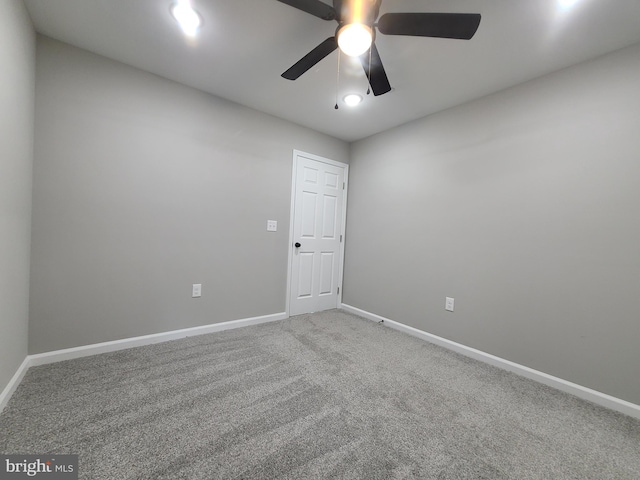 carpeted empty room with ceiling fan