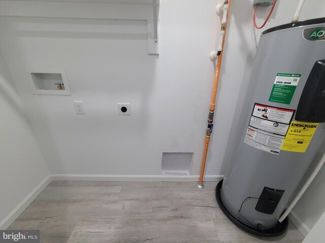 utility room featuring electric water heater