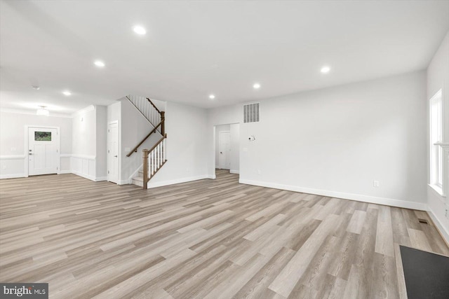 unfurnished living room featuring light wood-type flooring