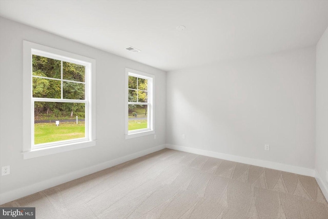 spare room with carpet floors