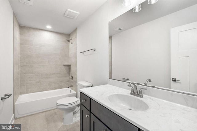 full bathroom with toilet, tiled shower / bath combo, and vanity