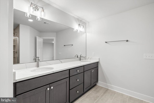 bathroom featuring vanity and tile patterned flooring