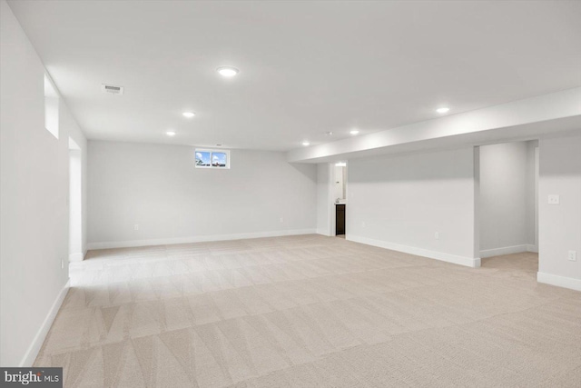 basement with light colored carpet