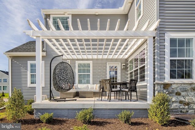 exterior space with a shingled roof and outdoor lounge area