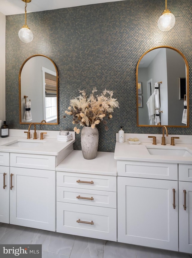 full bath with vanity and marble finish floor