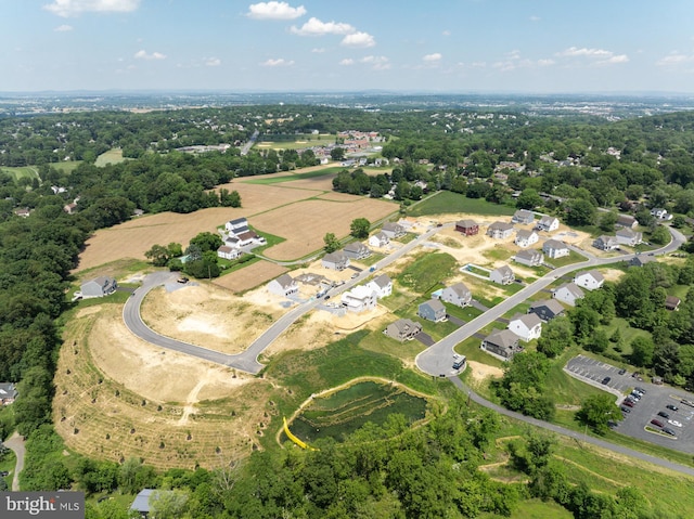 birds eye view of property with a residential view