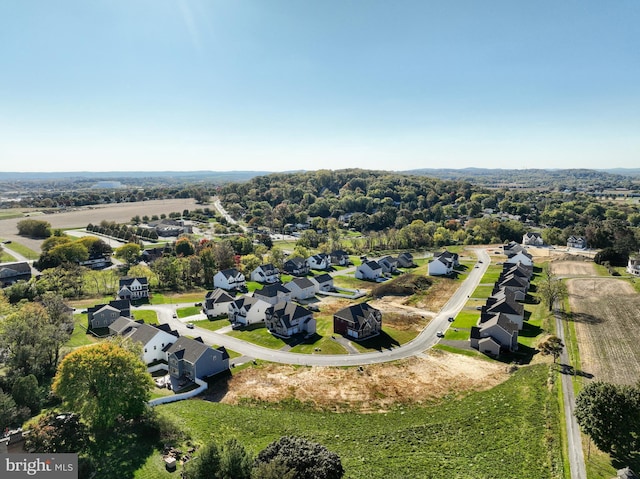 birds eye view of property with a residential view