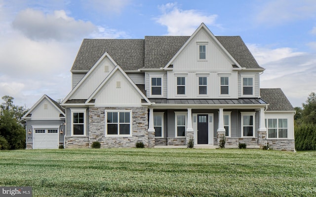 craftsman inspired home with a garage, covered porch, and a front yard