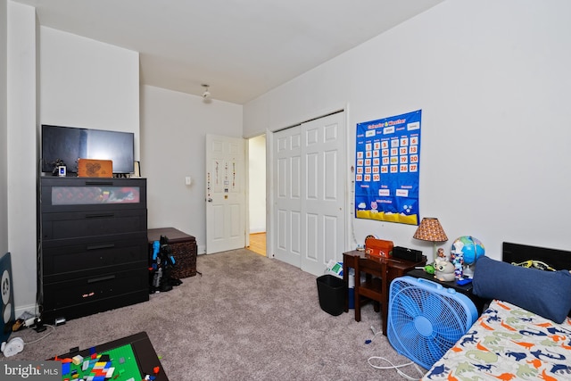 carpeted bedroom with a closet