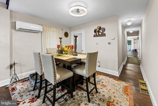 844 Cumberland St, Gloucester City, NJ 08030 - dining area with dark wood-style flooring, baseboards, and a wall mounted AC