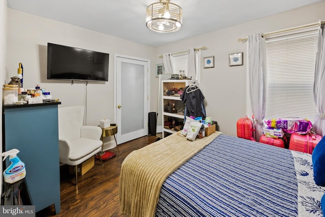 bedroom featuring dark wood-type flooring