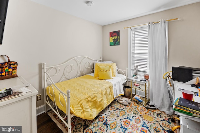 bedroom with hardwood / wood-style floors