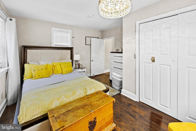 bedroom with dark wood-type flooring