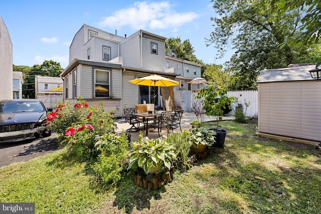 844 Cumberland St, Gloucester City, NJ 08030 - back of property with a patio, an outdoor structure, fence, a yard, and a shed
