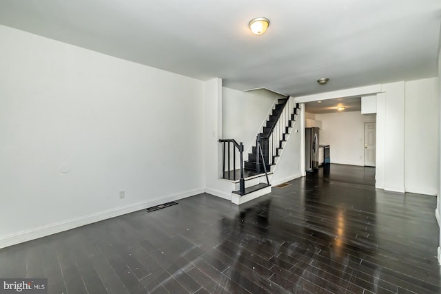 unfurnished room featuring dark hardwood / wood-style floors