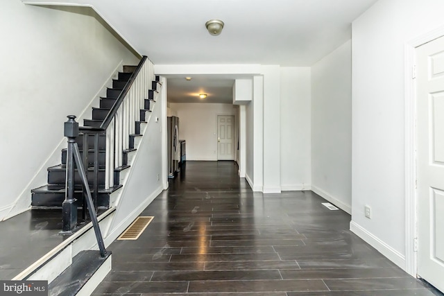 interior space with dark hardwood / wood-style floors