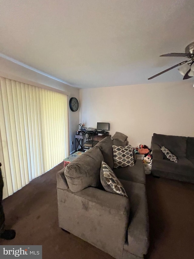 carpeted living room with ceiling fan