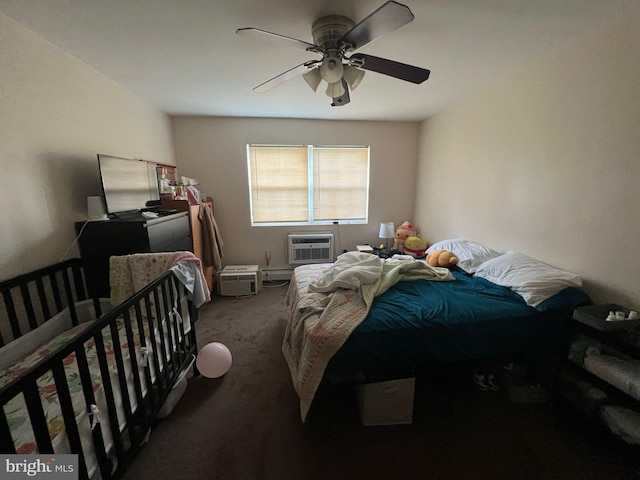 carpeted bedroom with an AC wall unit and ceiling fan