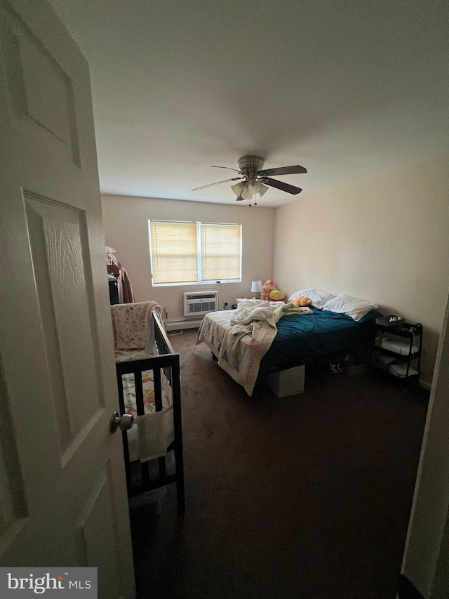 carpeted bedroom with an AC wall unit and ceiling fan