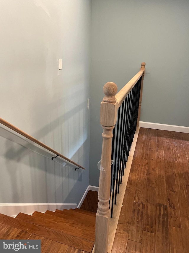 staircase featuring hardwood / wood-style floors