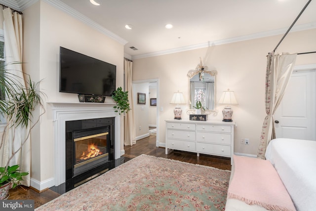 bedroom with ornamental molding, dark wood-style flooring, baseboards, and a fireplace with flush hearth