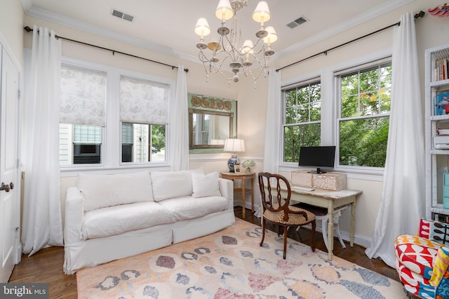 office area featuring wood finished floors, visible vents, and crown molding