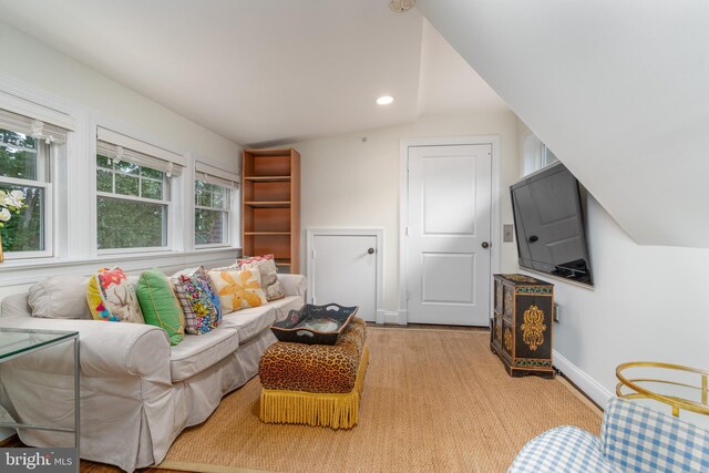 living room featuring recessed lighting and baseboards