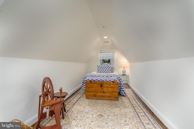 bedroom with lofted ceiling, baseboards, and recessed lighting