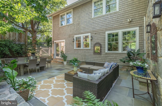 view of patio / terrace featuring fence, outdoor lounge area, and outdoor dining space