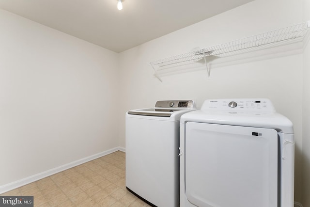 washroom with washer and dryer