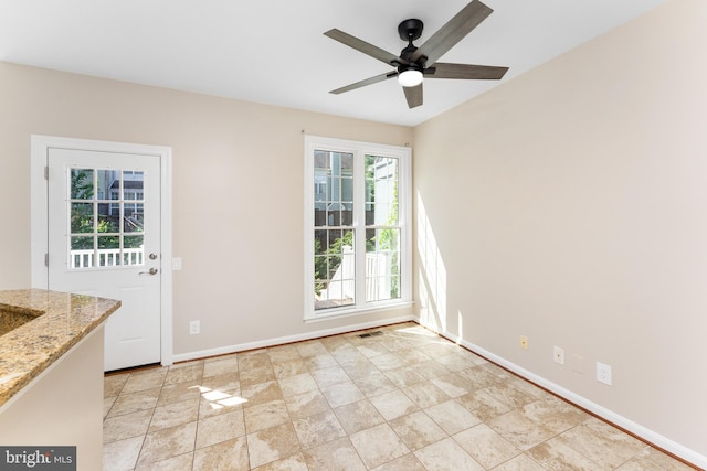 doorway to outside featuring ceiling fan