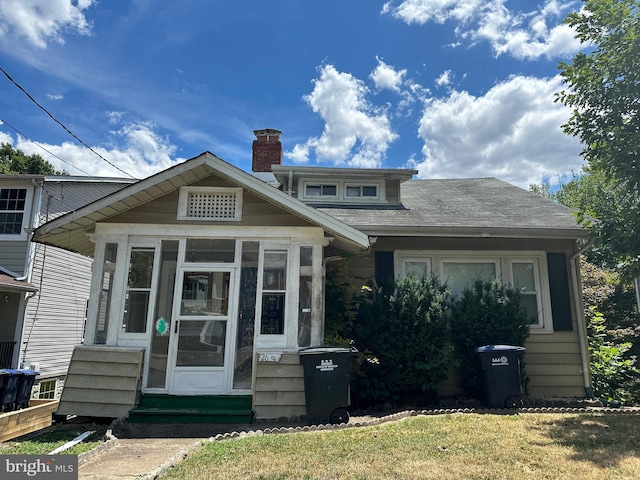 view of front facade featuring a sunroom