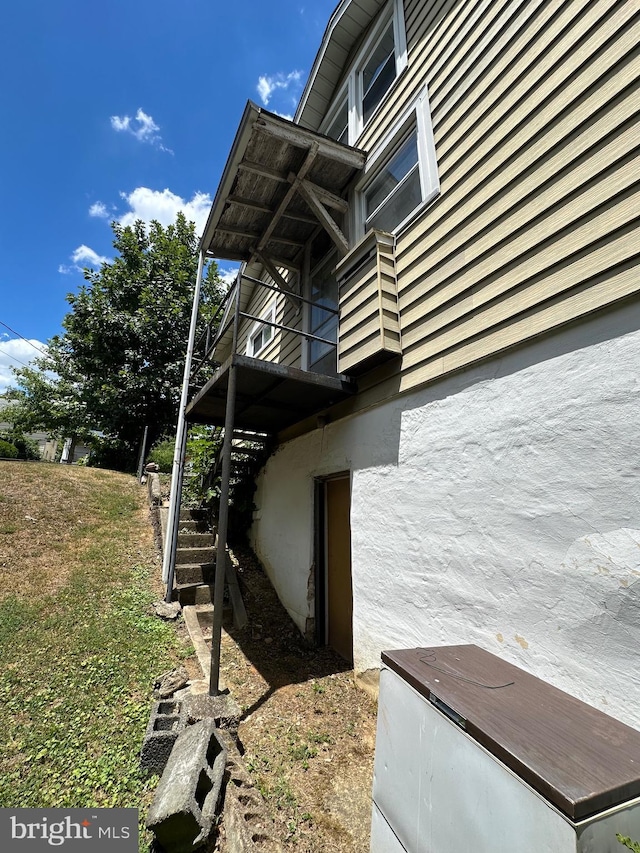 view of side of home with a balcony