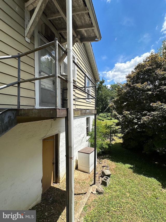 view of side of property with a yard