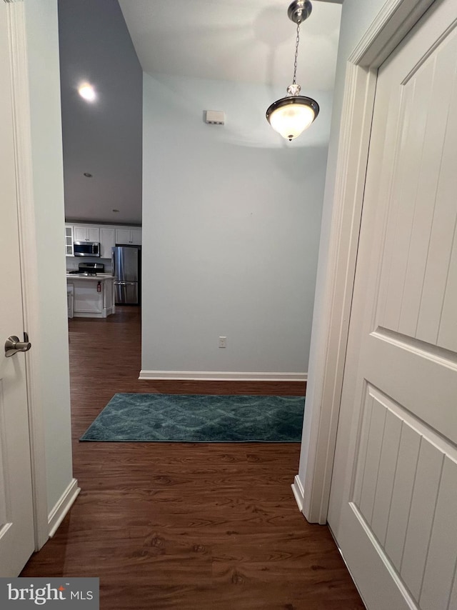 hall with dark hardwood / wood-style floors