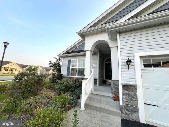 entrance to property featuring a garage