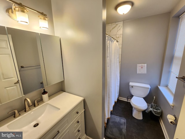 bathroom with tile patterned floors, toilet, and vanity