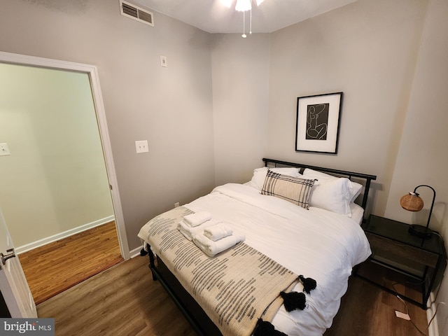 bedroom featuring dark hardwood / wood-style flooring