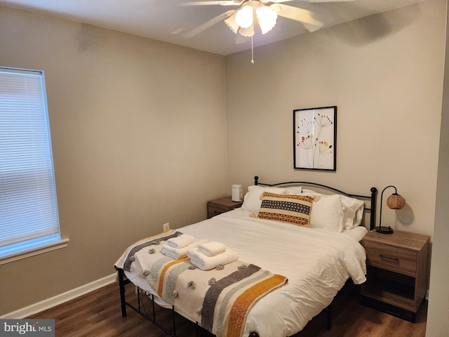 bedroom with dark wood-type flooring and ceiling fan