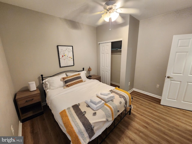 bedroom featuring a closet, hardwood / wood-style flooring, and ceiling fan