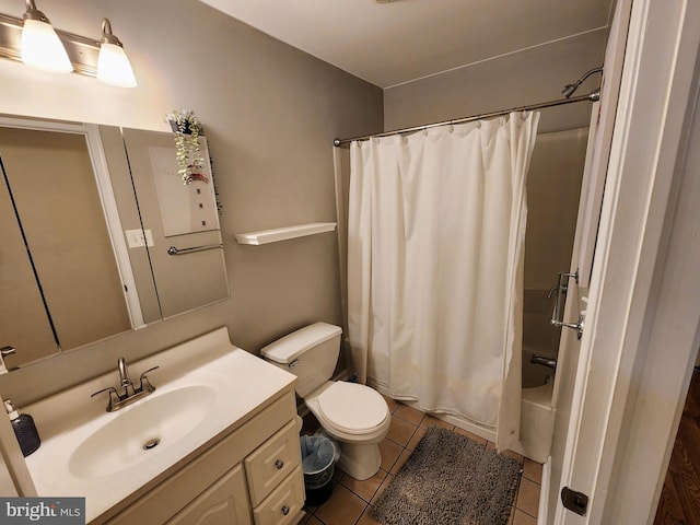 full bathroom featuring vanity, tile patterned floors, shower / tub combo, and toilet