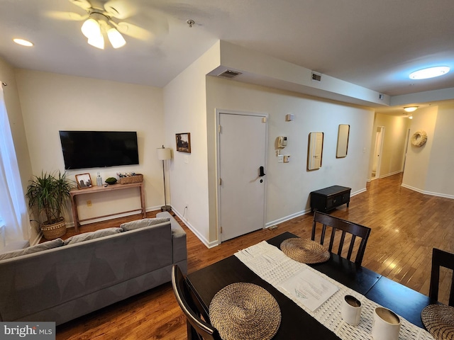 dining space with ceiling fan and hardwood / wood-style floors