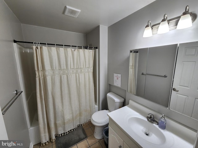 full bathroom featuring vanity, toilet, tile patterned flooring, and shower / tub combo